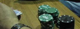 arms with poker chip stack