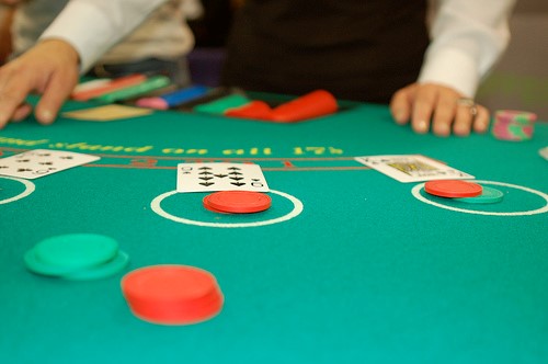 blackjack table with dealer