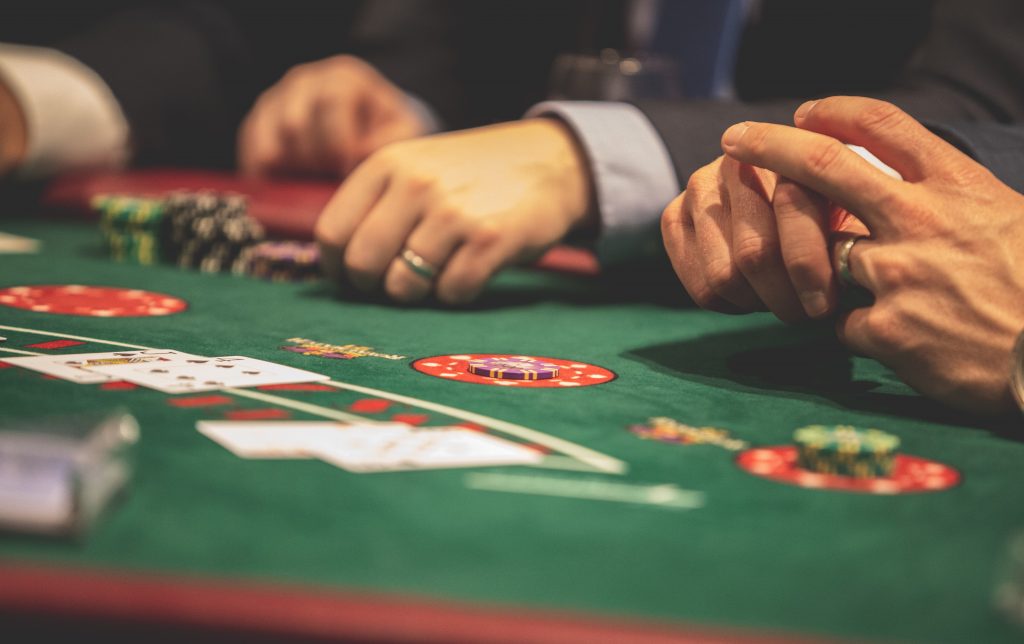 Hands on a blackjack table