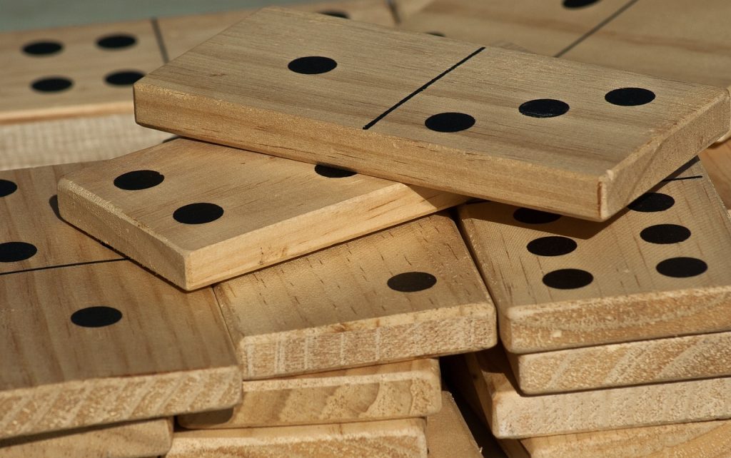 Wooden dominoes stacked on top of each other