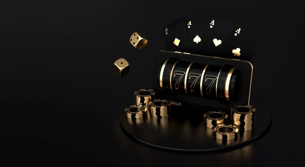 A golden and black slot machine with golden and black dice, cards, and poker chips surrounding it